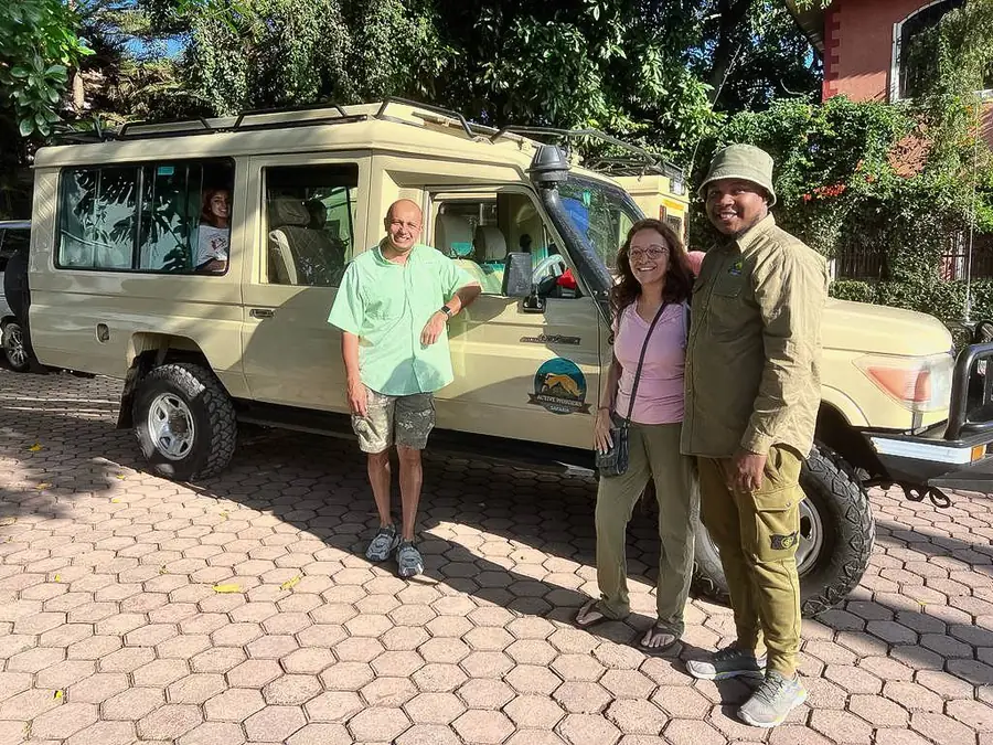 The Active Wonders owner with guests beside their safari vehicle